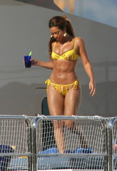 Beyonce in a yellow bikini
