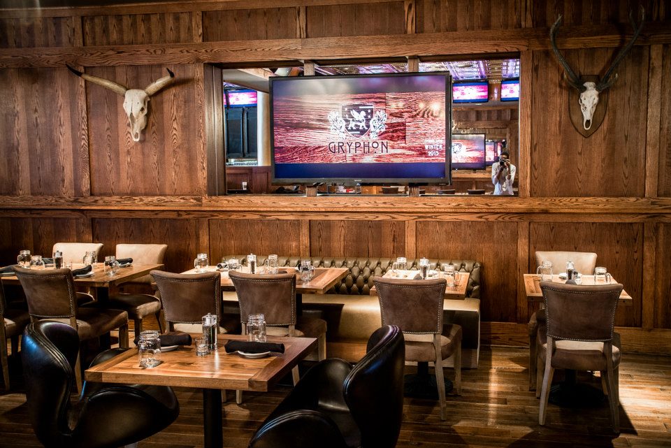 The wood paneled dining room at the new Gryphon restaurant and sports bar in DuPont.