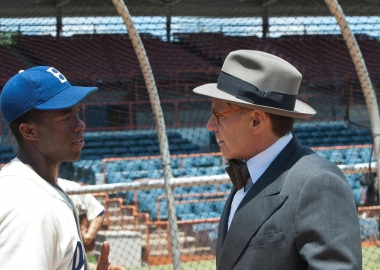 Chadwick Boseman (left) as the legendary Brooklyn Dodger Jackie Robinson and Harrison Ford (right) as General Manager Branch Rickey.