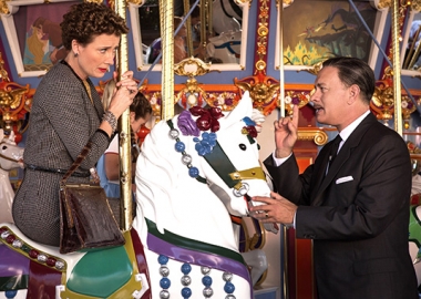 PL Travers (Emma Thompson) and Walt Disney (Tom Hanks) on the carousel at Disneyland. (Photo: Walt Disney Studios)