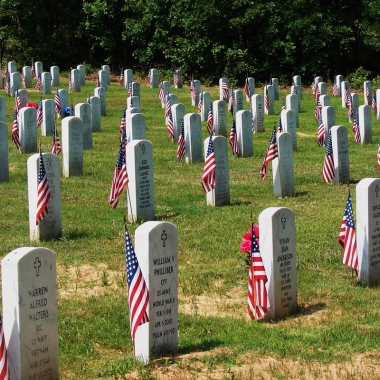 Graved at Arlington National Cemetery are decorated with flags for Memorial Day. (Photo: Indian Barrister)