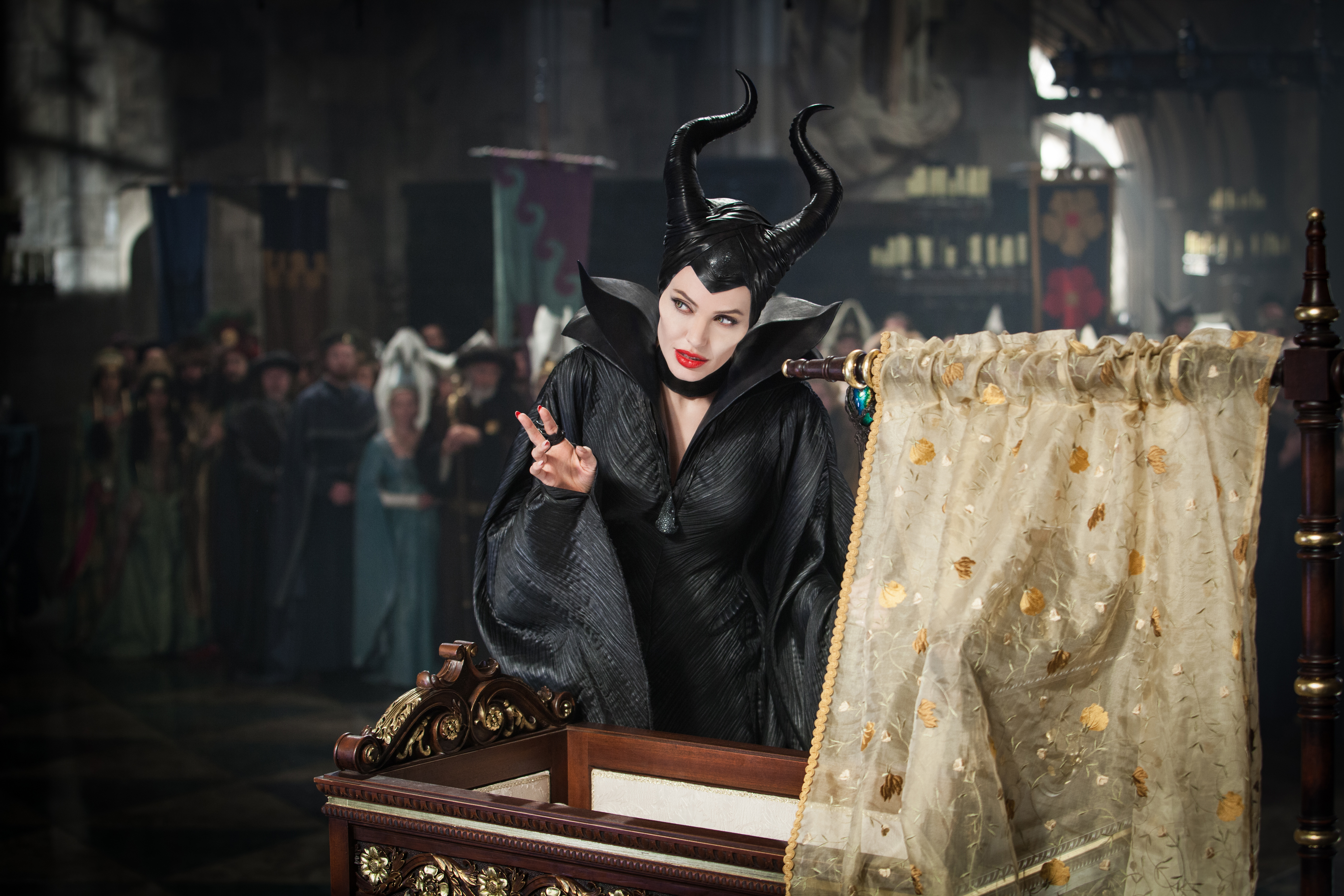 "Maleficent" (Angelina Jolie) cast a spell on baby Aurora. (Photo: Frank Connor/Walt Disney Studios)