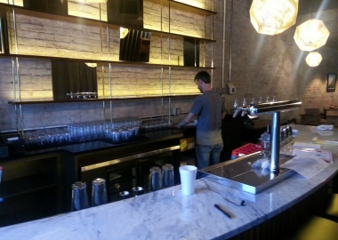 An employee set up the bar at DC Harvest. (Photo: DC Harvest/Facebook)