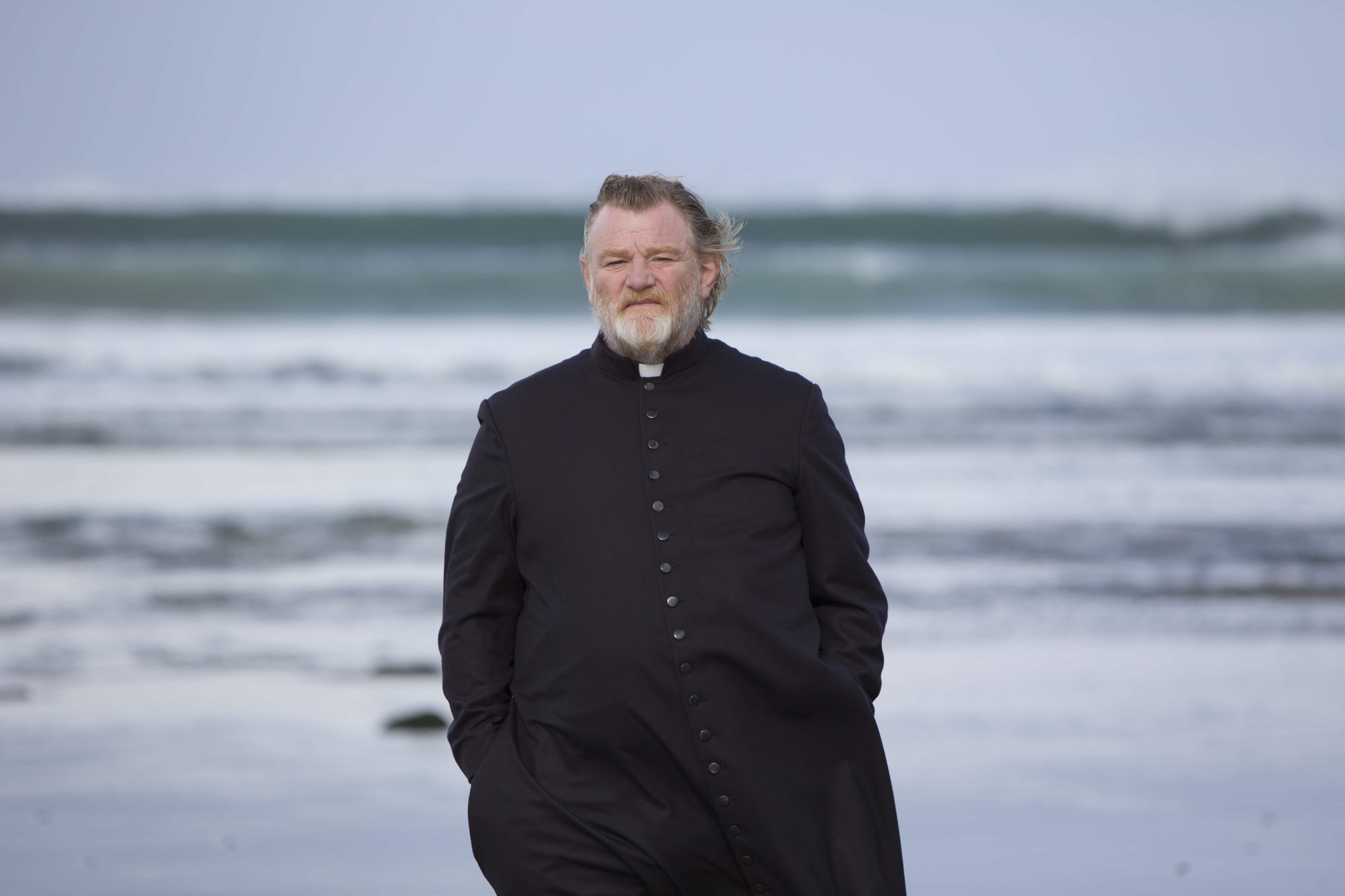 Father James (Brandon Gleeson) walks along an Irish beach were a parishioner plans to kill him for sins of a long-dead priest in "Calvary." (Photo: Fox Searchlight Studios)