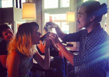 Bartender & consultant Eddie Kim trains the staff on proper Ice Cream Sandwich Luge form! (Photo: Pop's SeaBar/Facebook)