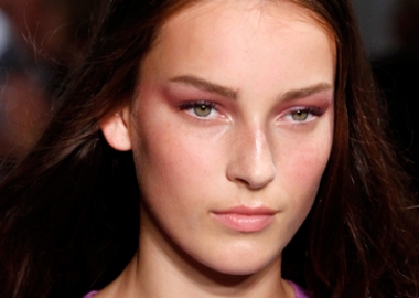 Tom Pecheux created a beautiful, translucent, almost bruise-like violet eye paired with a soft pink lip for Derek Lam. (Photo: JP Yim/Getty Images)