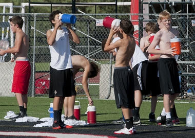 To prevent heat stroke, athletes should be properly hydrated before practice and take frequent water breaks in the shade. (Photo Daniel Friedman)