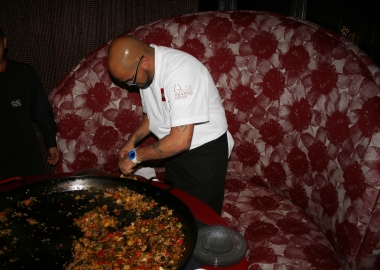 A chef serves paella with seasonal vegetables from a big paella pan at last year's paella festival. (Photo: Mark Heckathorn/DC on Heels)