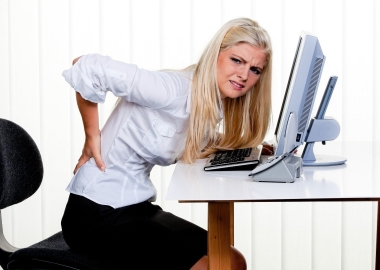 Back pain can be brought on by many different causes, spanning from the purse you carry to your desk at work. (Photo: Shutterstock)