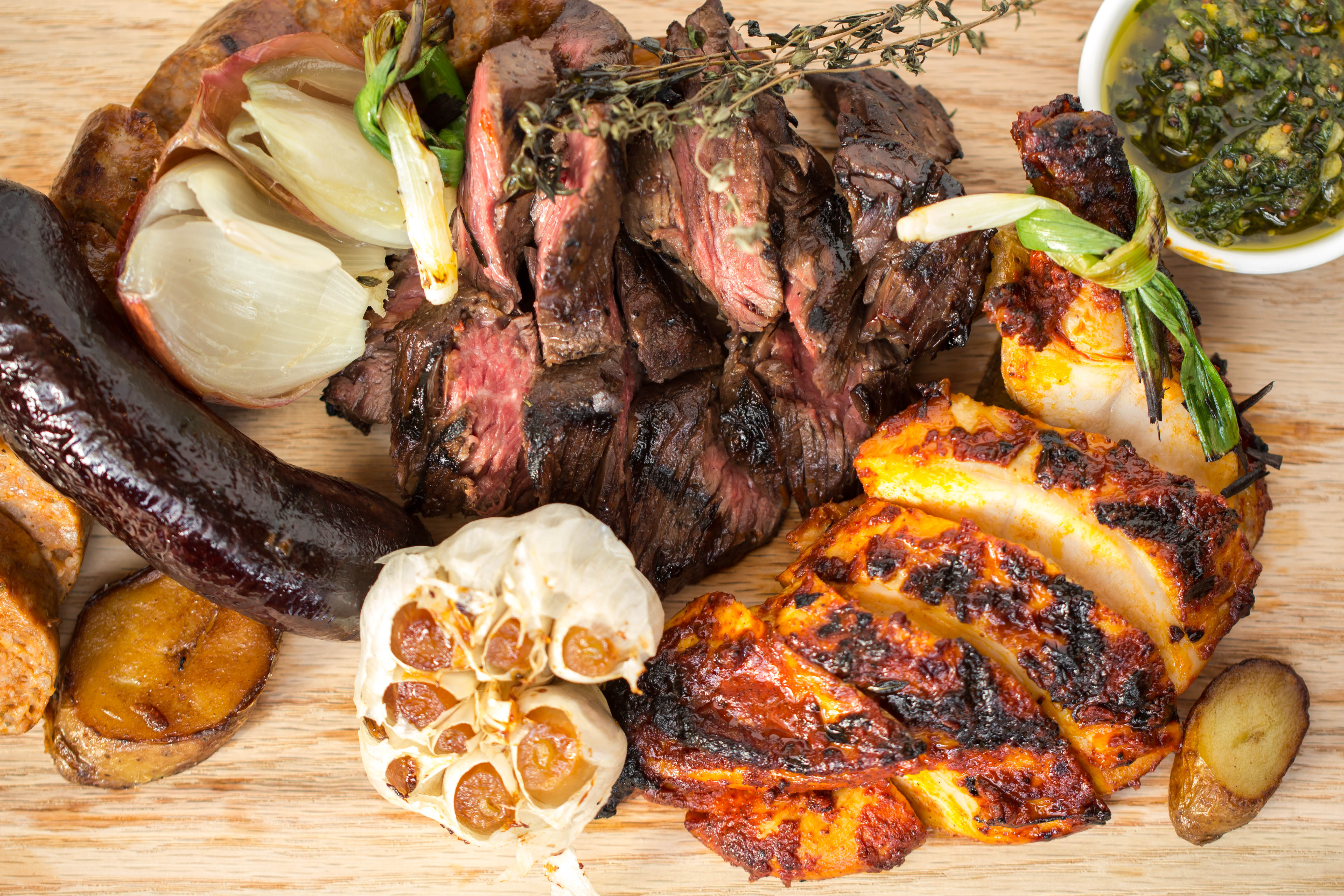The Argentinian parrillada mixed grill for two with hanger steak, sweet chorizo, blood sausage, grilled chicken breast and black truffle chimichurri on Zengo's TK menu. (Photo: Zengo)