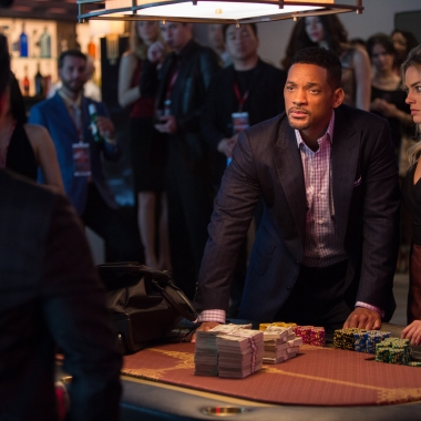 Nicky Spurgeon (Will Smith, left) is an extremely accomplished con man who takes an amateur con artist, Jess (Margot Robbie), under his wing in 