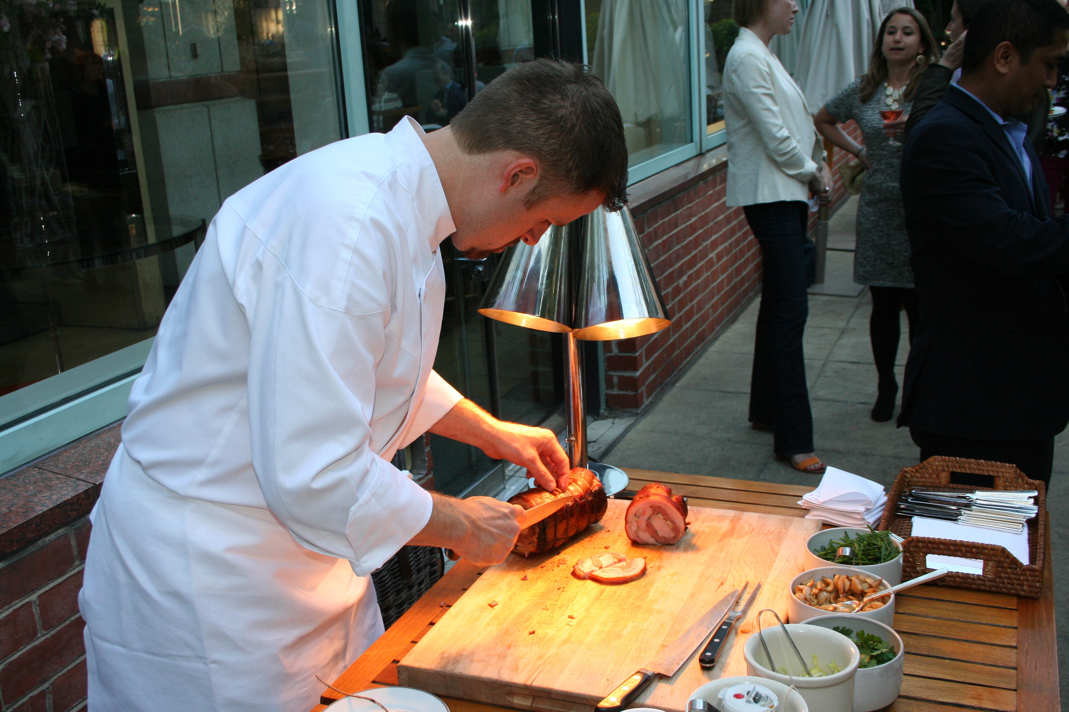 Chef de cuisine Brad Deboy carves slow-roasted porchetta. (Photo: Mark Heckathorn/DC on Heels)Chef de cuisine Brad Deboy carves slow-roasted porchetta. (Photo: Mark Heckathorn/DC on Heels)