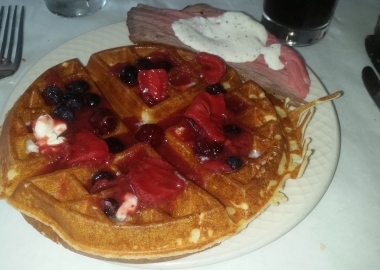 A made-to-order Belgian waffle with berry topping and rosemary crusted top round with horseradish sauce. (Photo: Mark Heckathorn/DC on Heels)