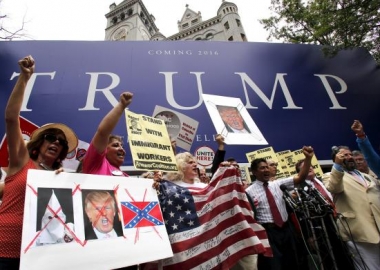 Protesters rally outside the Trump International Hotel construction site in the Old Post Office on Thursday. (Photo: Reuters)