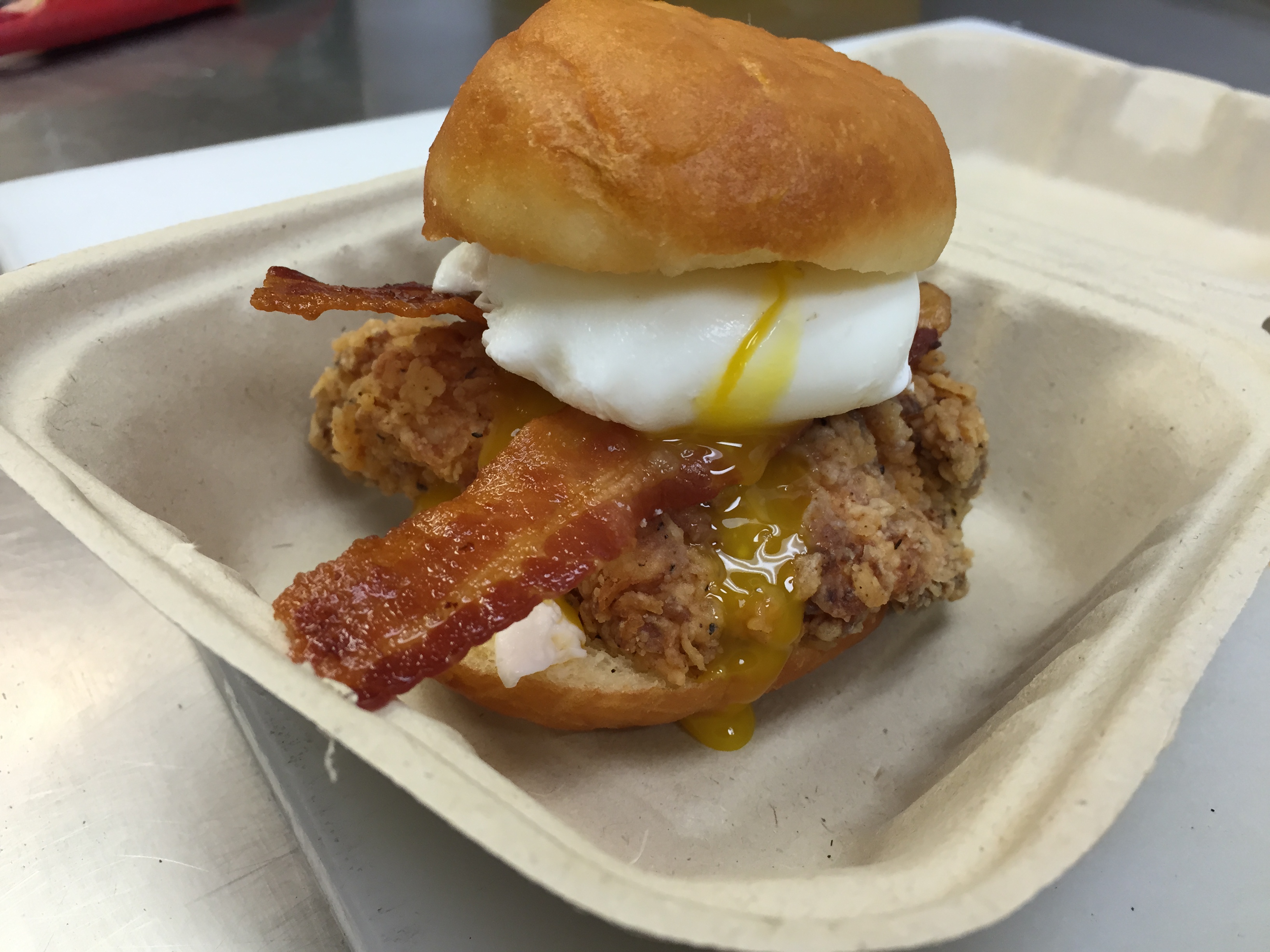 Astro Doughnuts & Fried Chicken unveils a new breakfast sandwich with poached egg, chicken and bacon on a savory doughnut last week. (Photo: Astro Doughnuts & Fried Chicken)