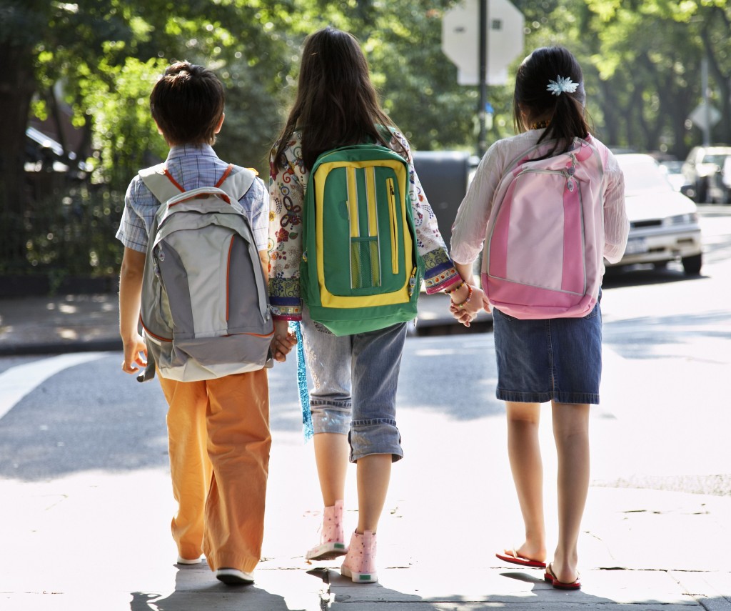 A major cause of back pain in children is due to carrying backpacks that are too heavy, too large, or not used properly. (Fuse/Thinkstock)