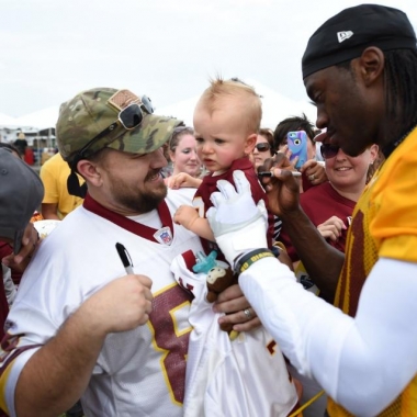 Fans get players' signatures on the first day of Redskins training camp in Richmond. (Photo: Washington Redskins)