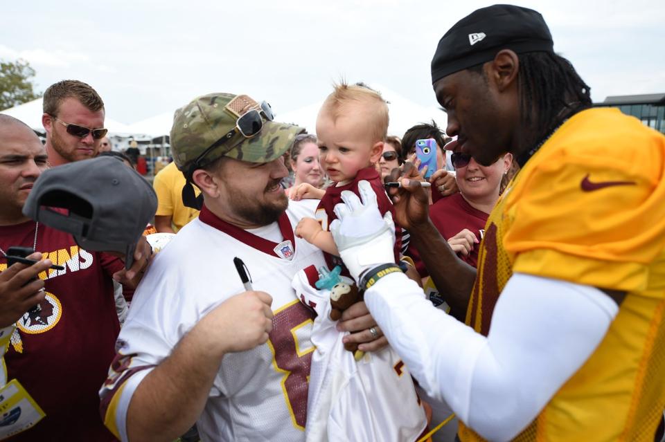 Fans get players' signatures from RGIII on the first day of Redskins training camp in Richmond. (Photo: Washington Redskins)