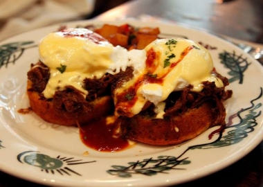 Columbus Day brunch at Commissary includes a pulled pork benedict on a cornbread muffin with BBQ hollandaise sauce. (Photo: Commissary/Facebook)