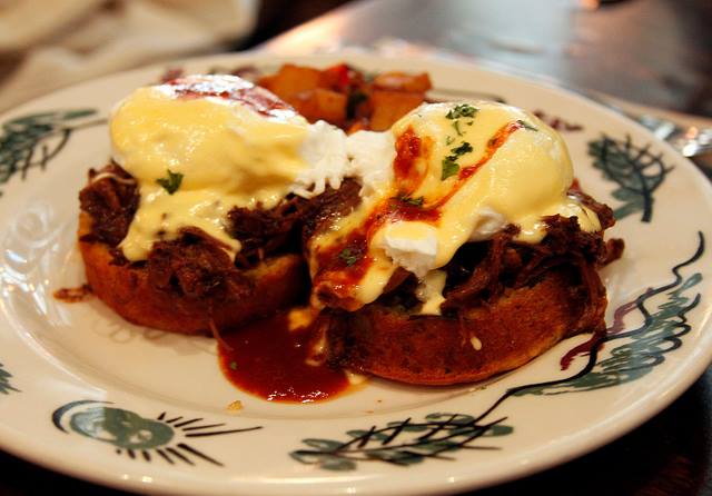 Columbus Day brunch at Commissary includes a pulled pork benedict on a cornbread muffin with BBQ hollandaise sauce. (Photo: Commissary/Facebook)