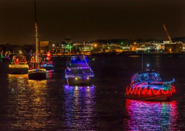 The annual Parade of Lights with 60 decorated boats will sail from Old Town to the southwest waterfront Saturday evening. (Photo; R. Kennedy/Arlington County Visitors Associations)