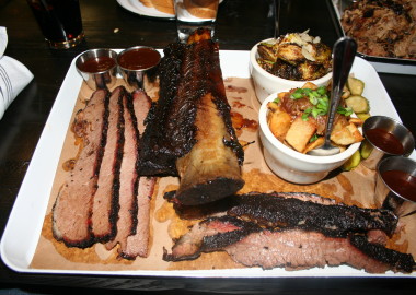 The beef brisket (left and bottom) was melt-in-your mouth perfect. Also pictures: beef short rib, fried Brussels sprouts (top) and crispy fried potatoes with warm bacon vinaigrette, (Photo: Mark Heckathorn/DC on Heels