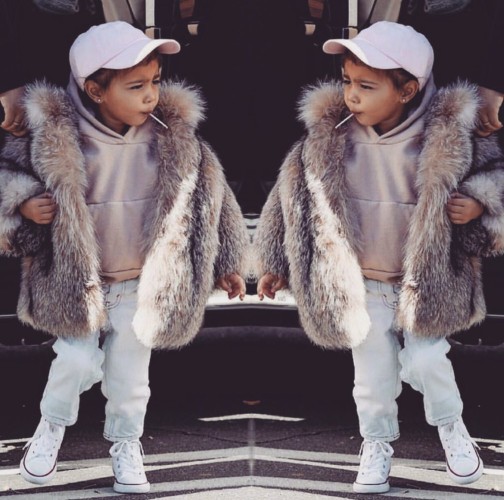 North West, Kim Kardashian and Kanye West's daughter, stepped out right before New Year's wearing a $3,500 fur coat. (Photo: KIm Kardashian/Twitter)