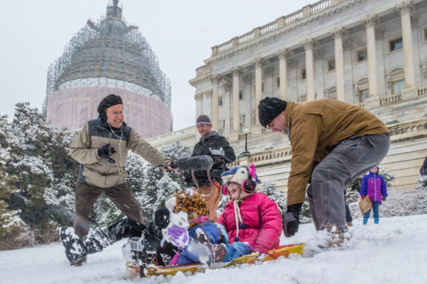 Sledders slide down the hill in front of the U.S. Capitol Building. (Photo: Joseph Gruber)