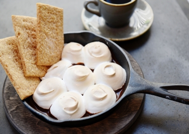 Desserts include campfire skillets like the dark chocolate skillet with banana, topped with marshmallow and homemade graham crackers and s'mores. (Photo: Bonfire)