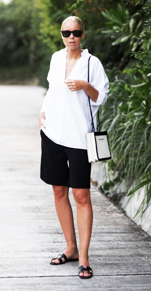 Pair one of your boyfriend's button-down shirts with culottes or a midi skirt. (Photo: Victoria Tornegren)