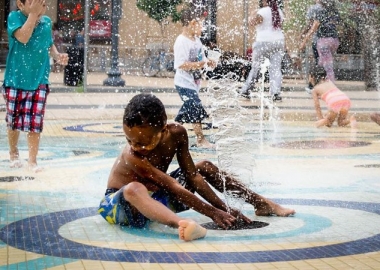 Kids cool down during the recent heat wave in the fountain at the Columbia Heights Civic Plaza. (Photo: vpickering/Flickr)