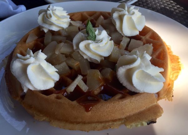 The poached pear waffle with caramel sauce and whipped cream at Ambar. (Photo: Peter G./Yelp)