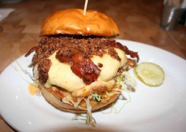The Big Pig with an andouille and beef blended patty is topped with Applewood smoked bacon, lettuce, bacon onion jam, smoked mozzarella and garlic mayo. (Photo: Mark Heckathorn/DC on Heels)