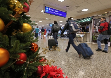 Keep germs at bay during holiday travels with the four tips. (Photo: George Frey/Getty Images)