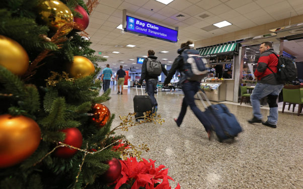 Keep germs at bay during holiday travels with the four tips.  (Photo: George Frey/Getty Images)