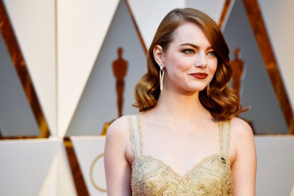 Emma Stone's curls had a shiny effect thanks to a L'Oréal Satin Hairspray. (Photo: Frazer Harrison/Getty Images)