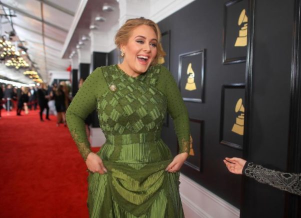 Adele wore a Givenchy Hate Couture silk satin and lace gown in military green. (Photo: Christopher Polk/Getty Images)