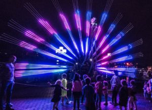Visitors to Light City in Baltimomre admire The Peacock. (Photo: Light City)