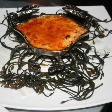 The flaming crab dip is served in a crab-shaped pan and flambeed tableside. (Photo: Mark Heckathorn/DC on Heels)