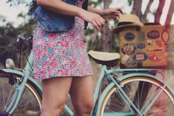 woman in flowered dress with bicycle (Photo: Pixabay)