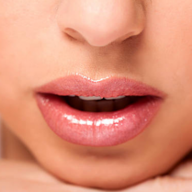 Shiny lip glosses come in nudes and can give off as vibrant a color as a matte lipstick. (Photo: iStock)