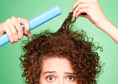 Tired to straightening your hair? Try these conditioners to tame your curly locks. (Photo: Matthew Reier)