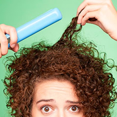 Tired to straightening your hair? Try these conditioners to tame your curly locks. (Photo: Matthew Reier)