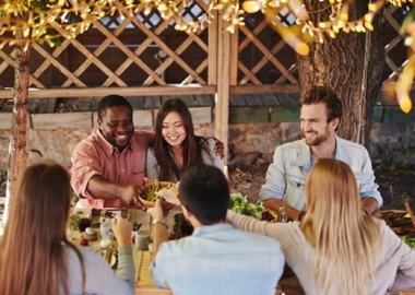 Surround yourself with good company and plenty of food. (Photo: Shutterstock)