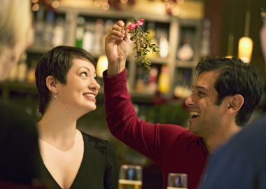 Even if there is mistletoe, it is best to keep thing professional and not kiss it at your office holiday party. (Photo: Getty Images)