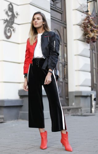 The combination of red and black can be really chic, especially with velour culottes and a pair of red kitten heel boots. (Photo: Nika Huk)