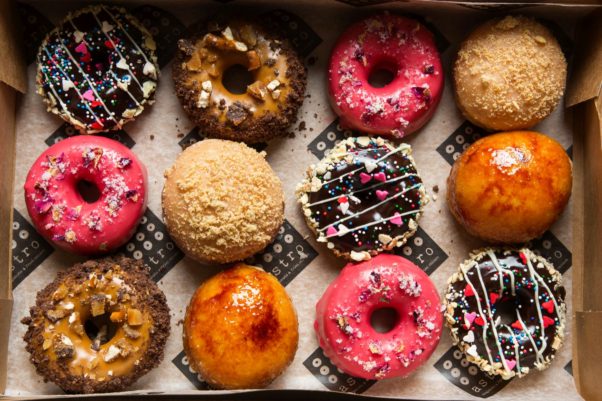 Astro Doughnuts & Fried Chicked adds four new doughnuts to its menu for February and will offer Valentine's Day boxes (pictured) on Feb. 14. (Photo: Scott Suchman)