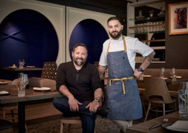 Mike Isabella (seated) and chef Michael Rifidi at Arroz (Photo: Arroz)