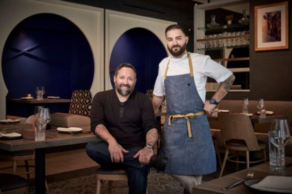 Mike Isabella (seated) and chef Michael Rifidi at Arroz (Photo: Arroz)