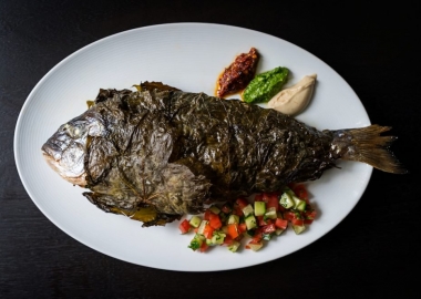 Sababa will feature modern Isreali cuisine including a daily whole roasted fish wrapped in grape leaved. (Photo: Scott Suchman)